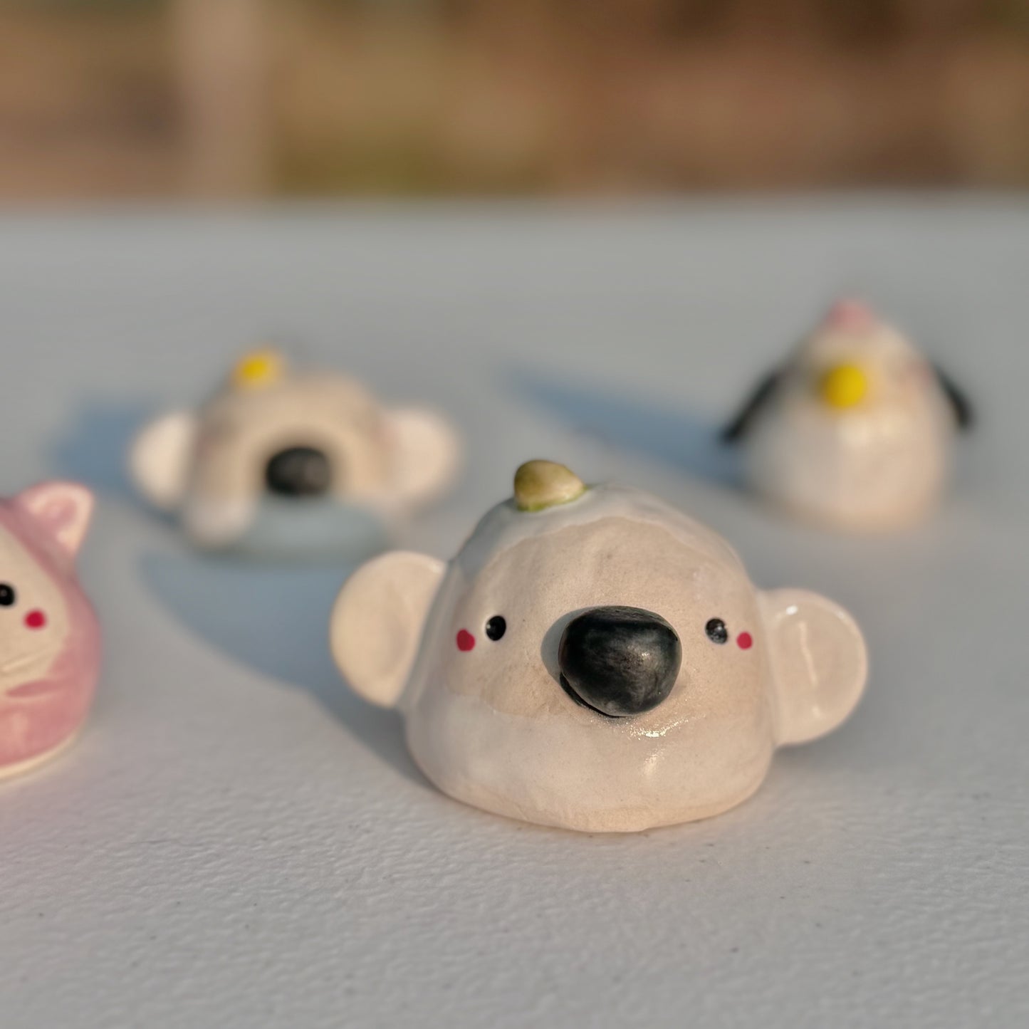 Handcrafted Porcelain Animal Ornaments: Cat, Bear, & Penguin